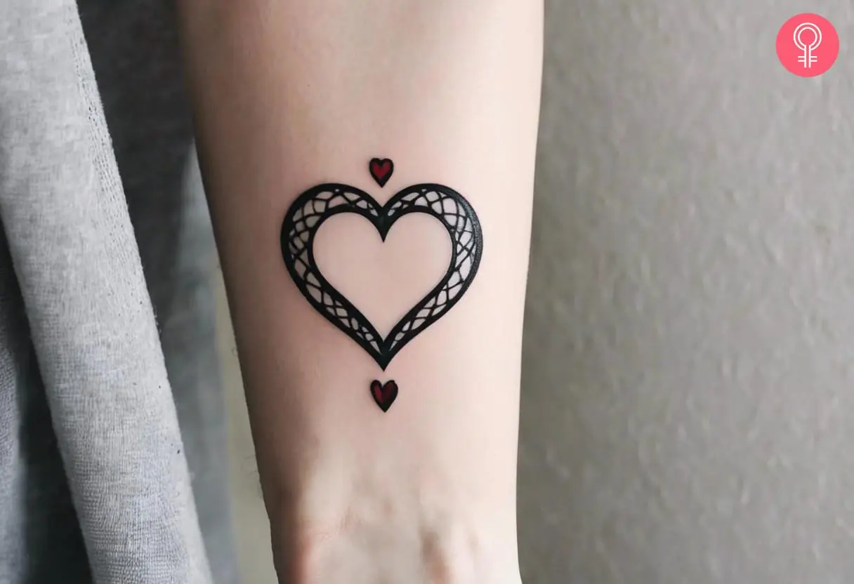 A woman with a heart tattoo on her wrist