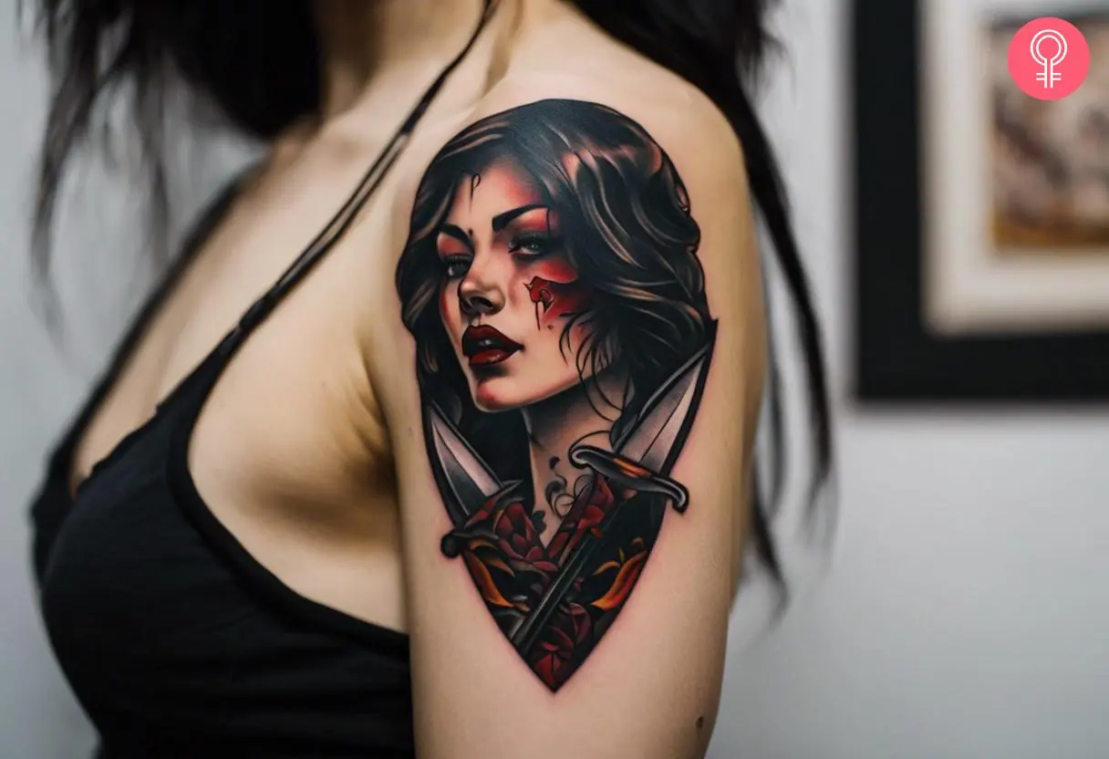 A woman with a horror knife tattoo on her upper arm