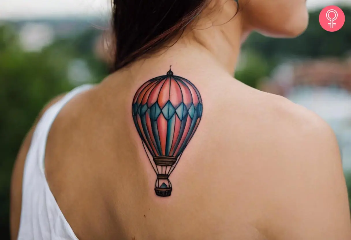 A woman with a hot air balloon tattoo on her back