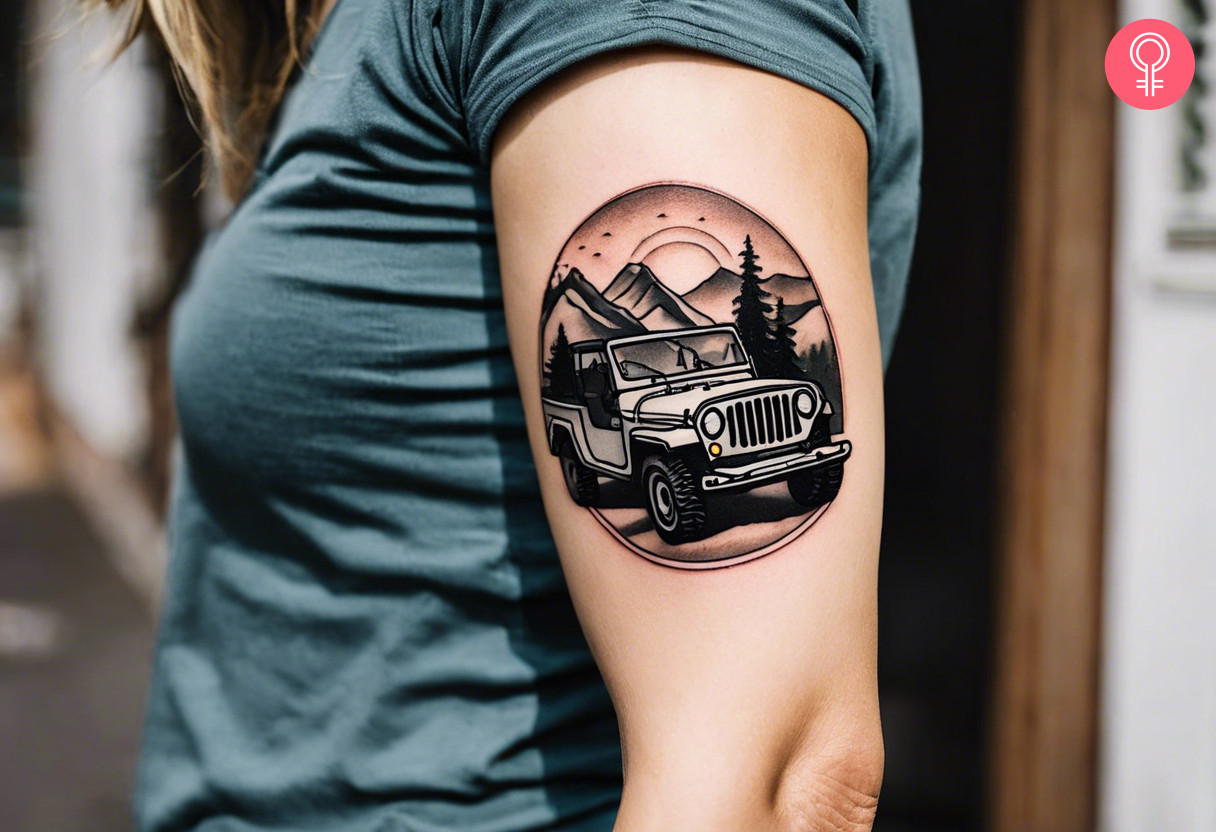 A woman with a jeep mountain tattoo on her upper arm