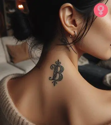 A woman with a letter b tattoo on her neck