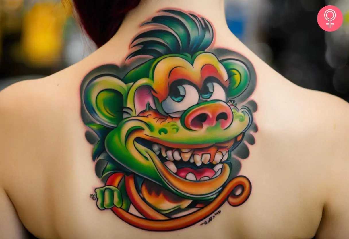 A woman with a rat fink tattoo on the upper back