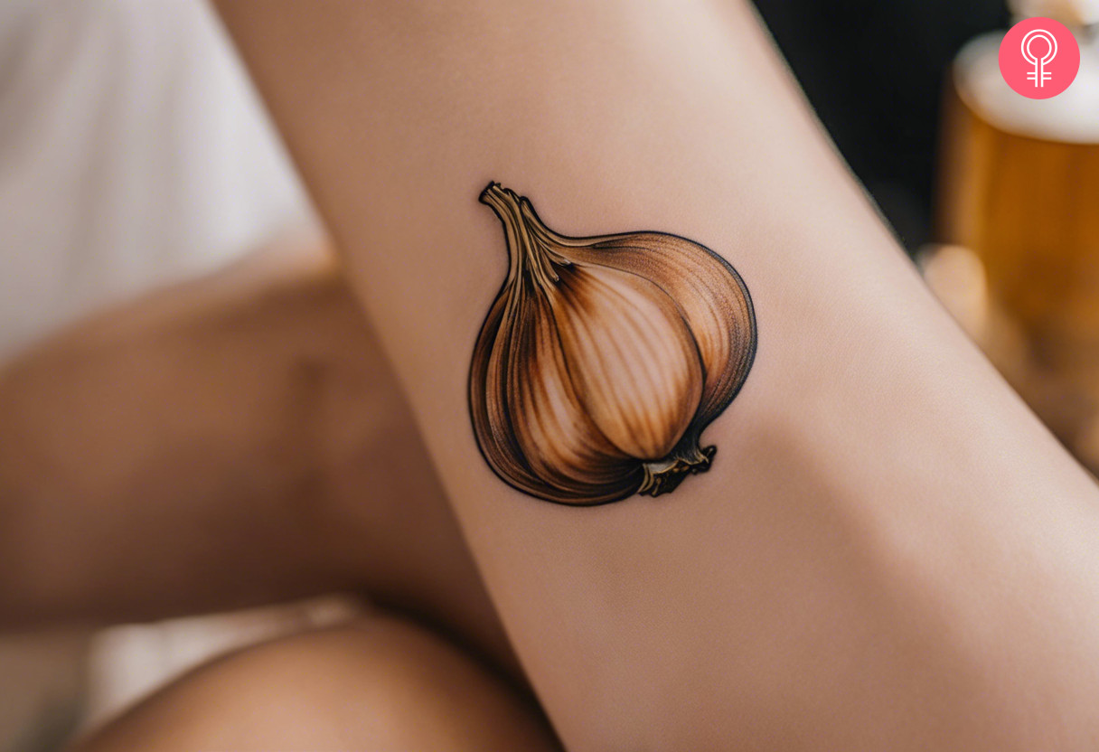 A woman with a roasted garlic tattoo on her forearm