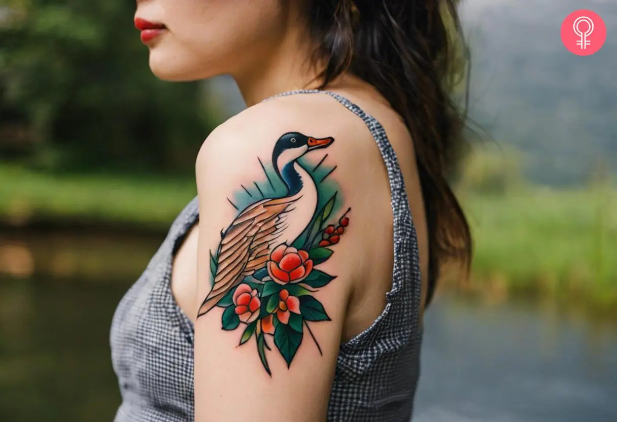 A woman with a traditional goose tattoo on her upper arm