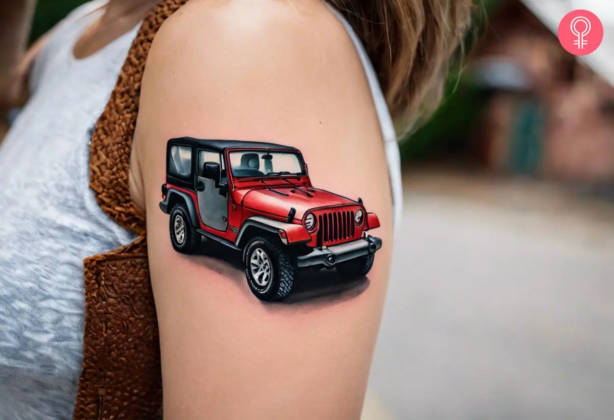 A woman with a vibrant red jeep tattoo on her upper arm