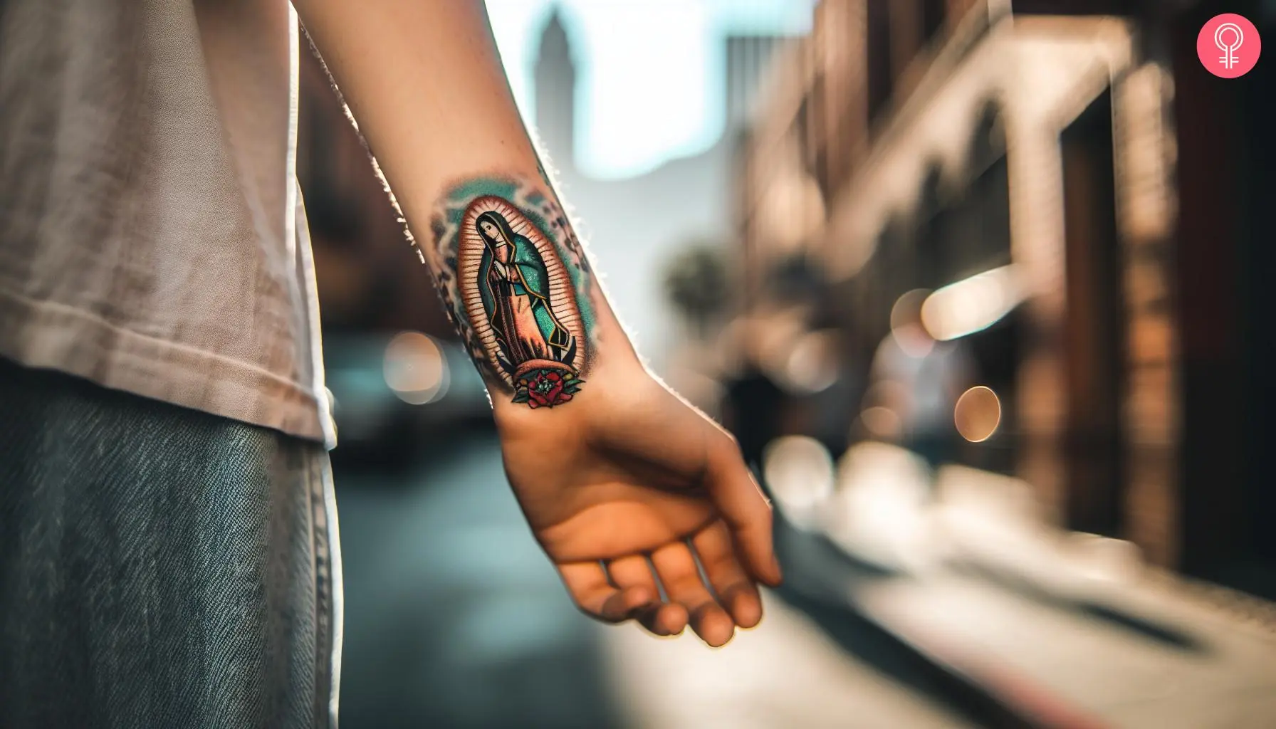 A woman with a virgen de guadalupe tattoo on her wrist