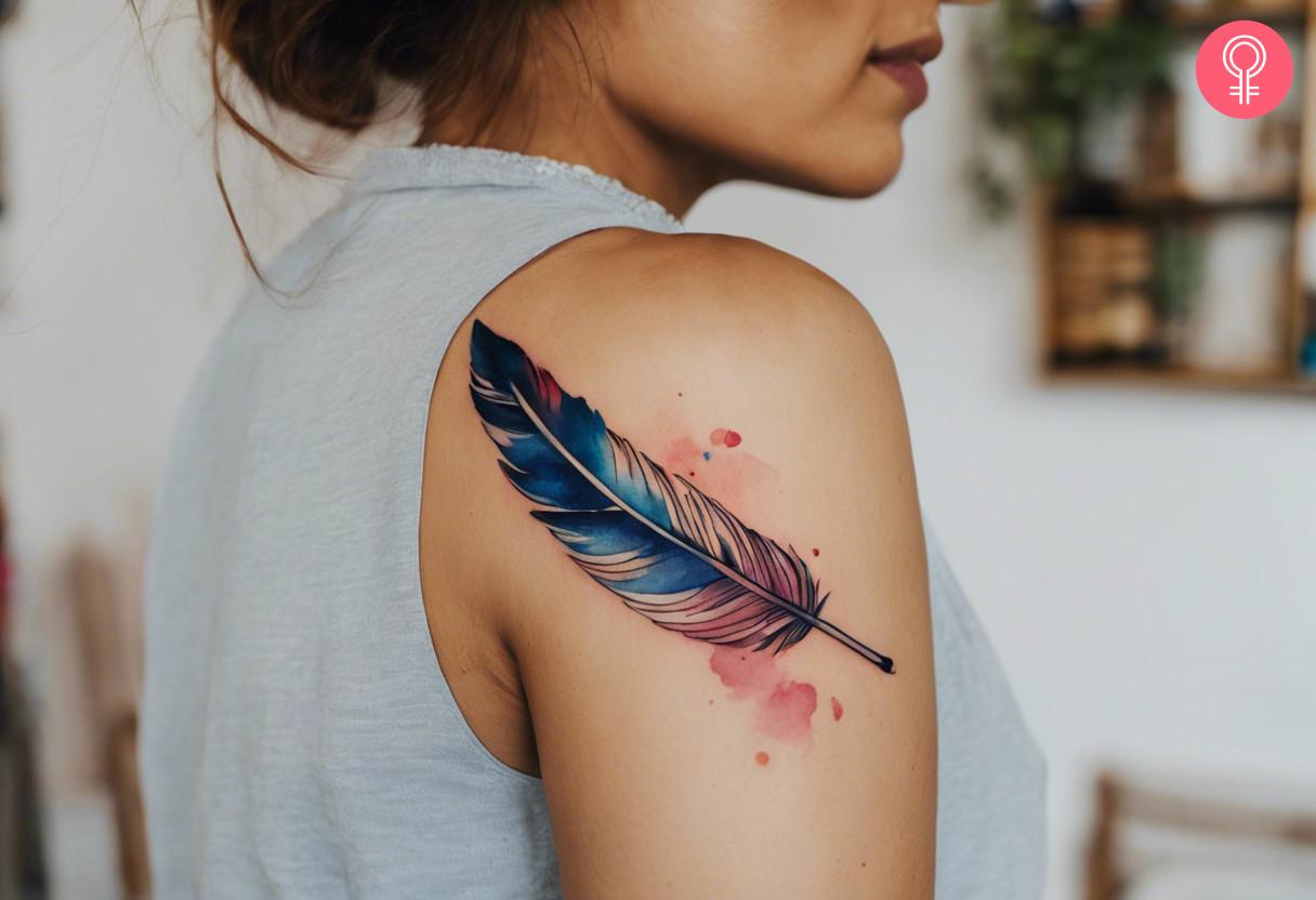 A woman with a watercolor-style quill tattoo on her upper arm