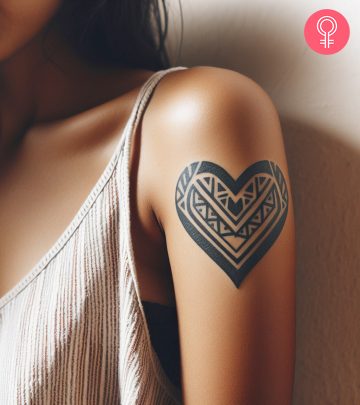 Woman with Queen of Hearts tattoo on her arm