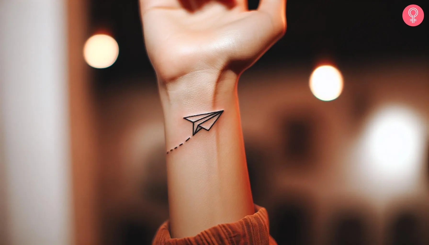 Air sign tattoo on the wrist of a woman