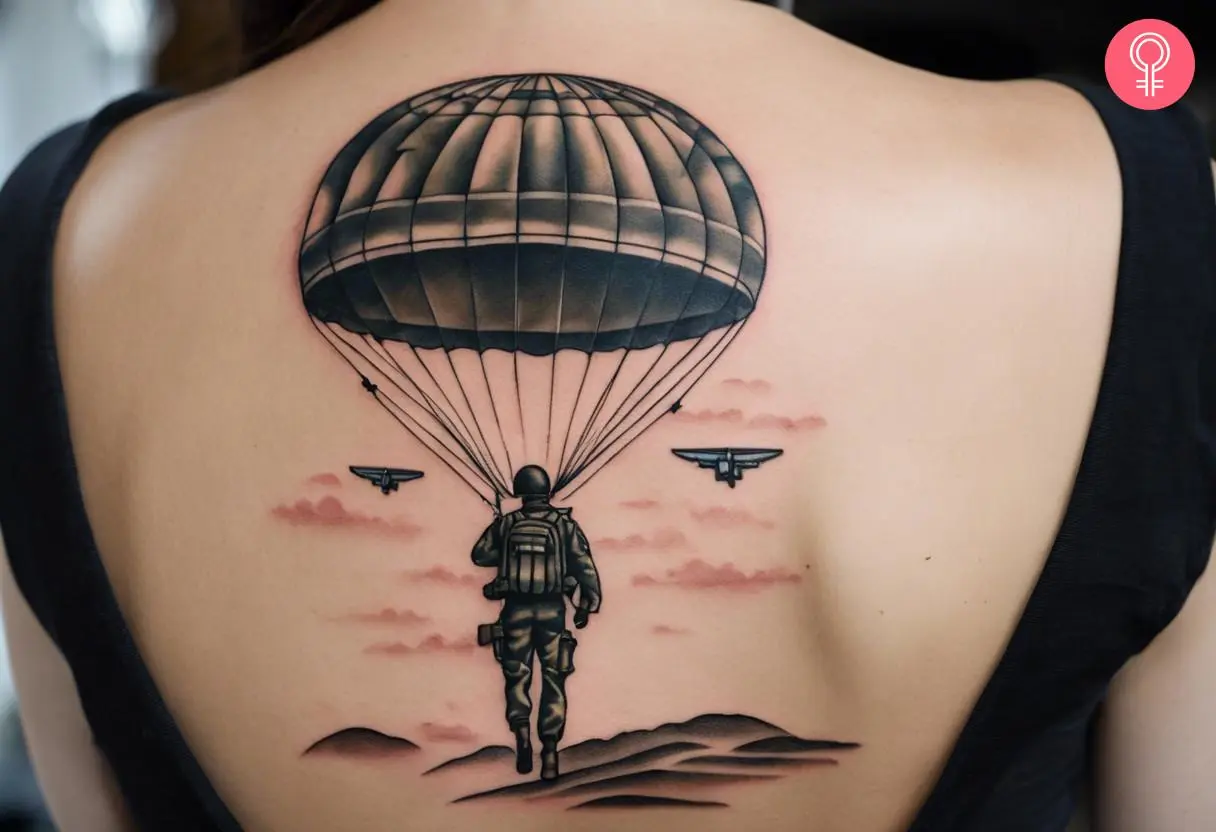 Airborne ranger tattoo on the upper back of a woman