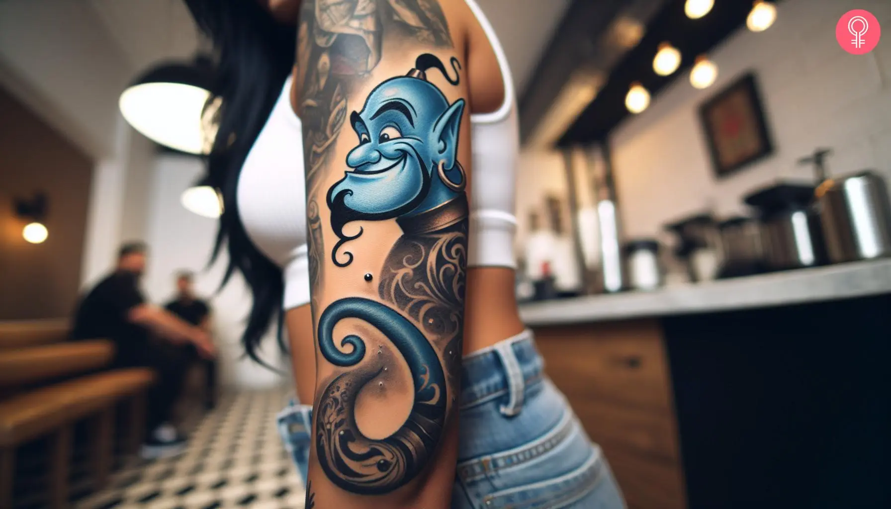 Aladdin genie tattoo on the arm of a woman