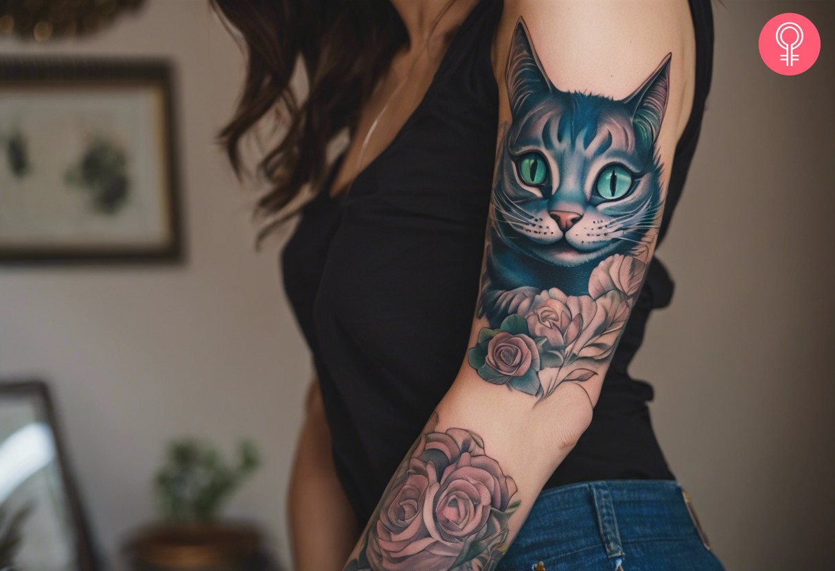 Alice In Wonderland Cheshire cat tattoo on a woman’s arm