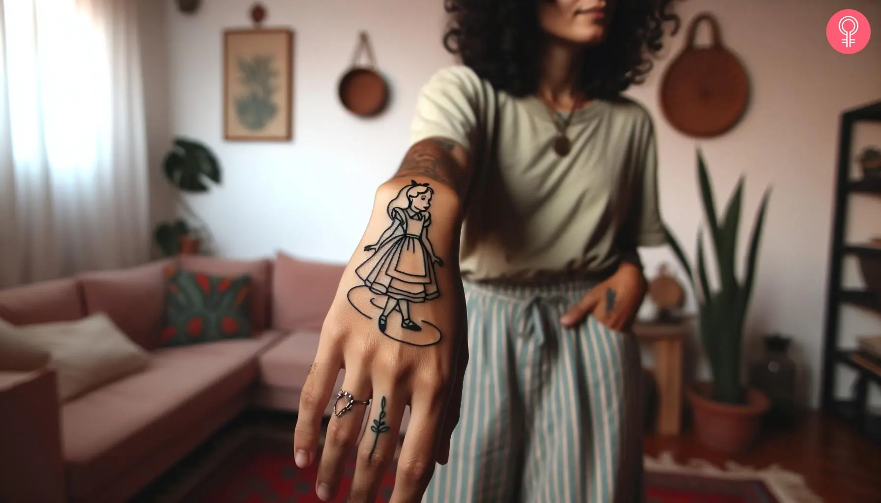 'Alice In Wonderland' outline tattoo on a woman’s hand