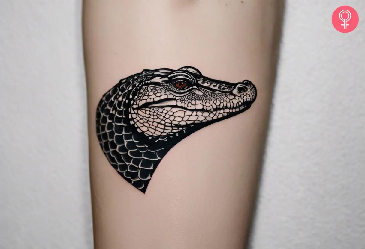 Alligator head tattoo on the arm