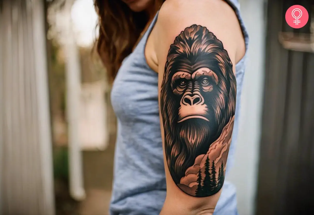 American traditional bigfoot tattoo on the upper arm of a woman