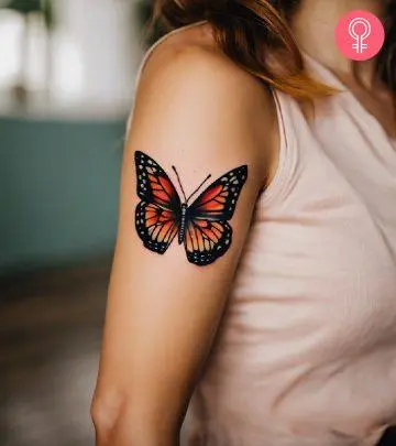 A woman with a spider web tattoo design