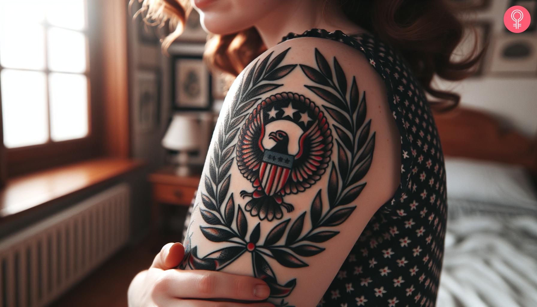 An American traditional tattoo on a woman’s arm featuring a laurel wreath