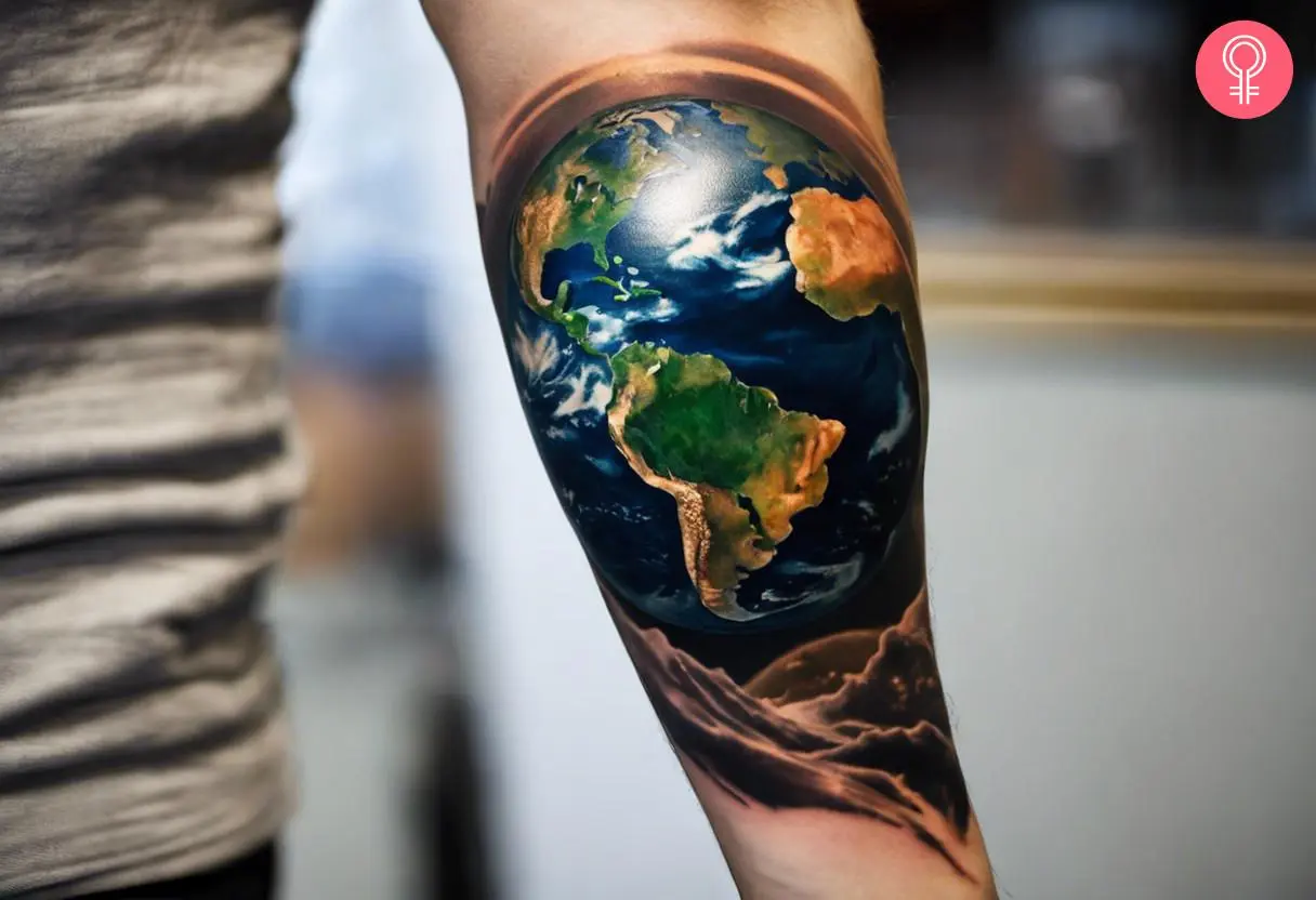 An Earth tattoo on the forearm