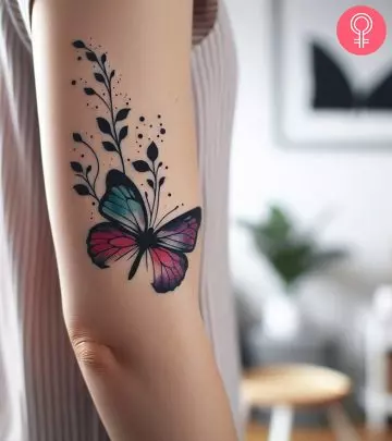 A woman with a 3D butterfly tattoo on her back