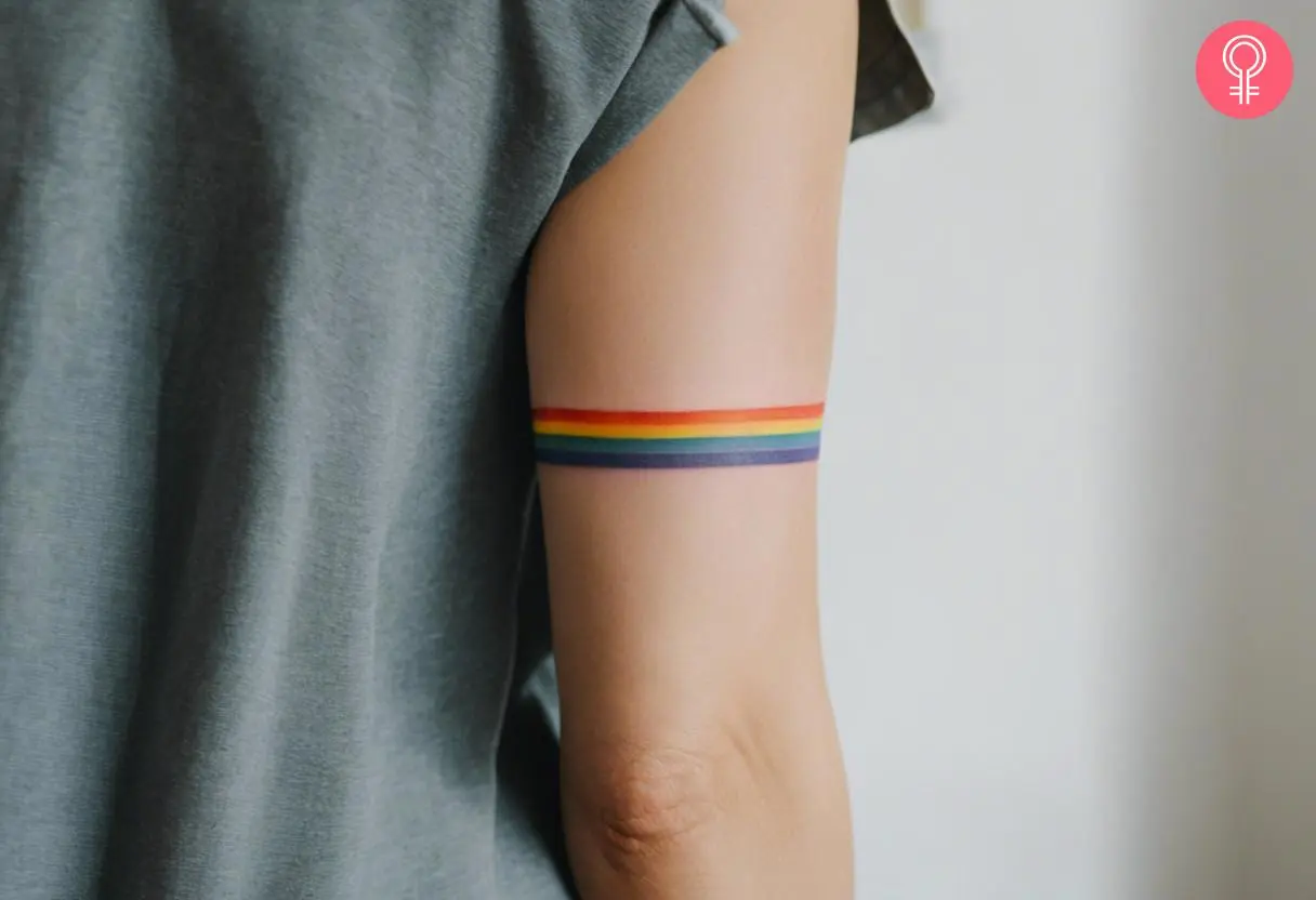 An armband tattoo with four colors of the rainbow