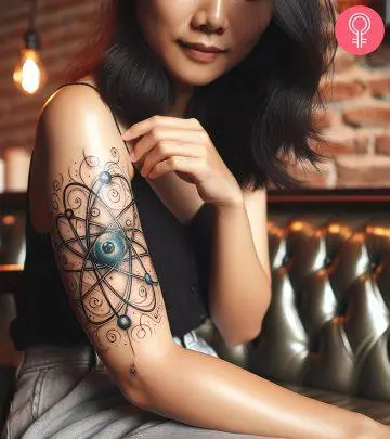 A woman with a solar system tattoo on her bicep