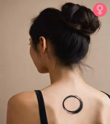 Woman with cancer glyph tattoo on her arm