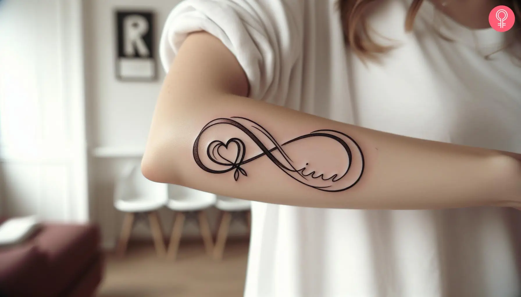 An infinity heart tattoo with initials