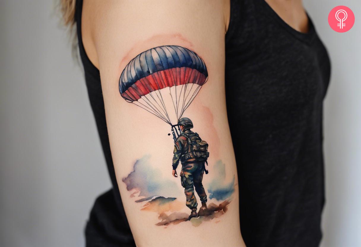 Army airborne tattoo on the upper arm of a woman