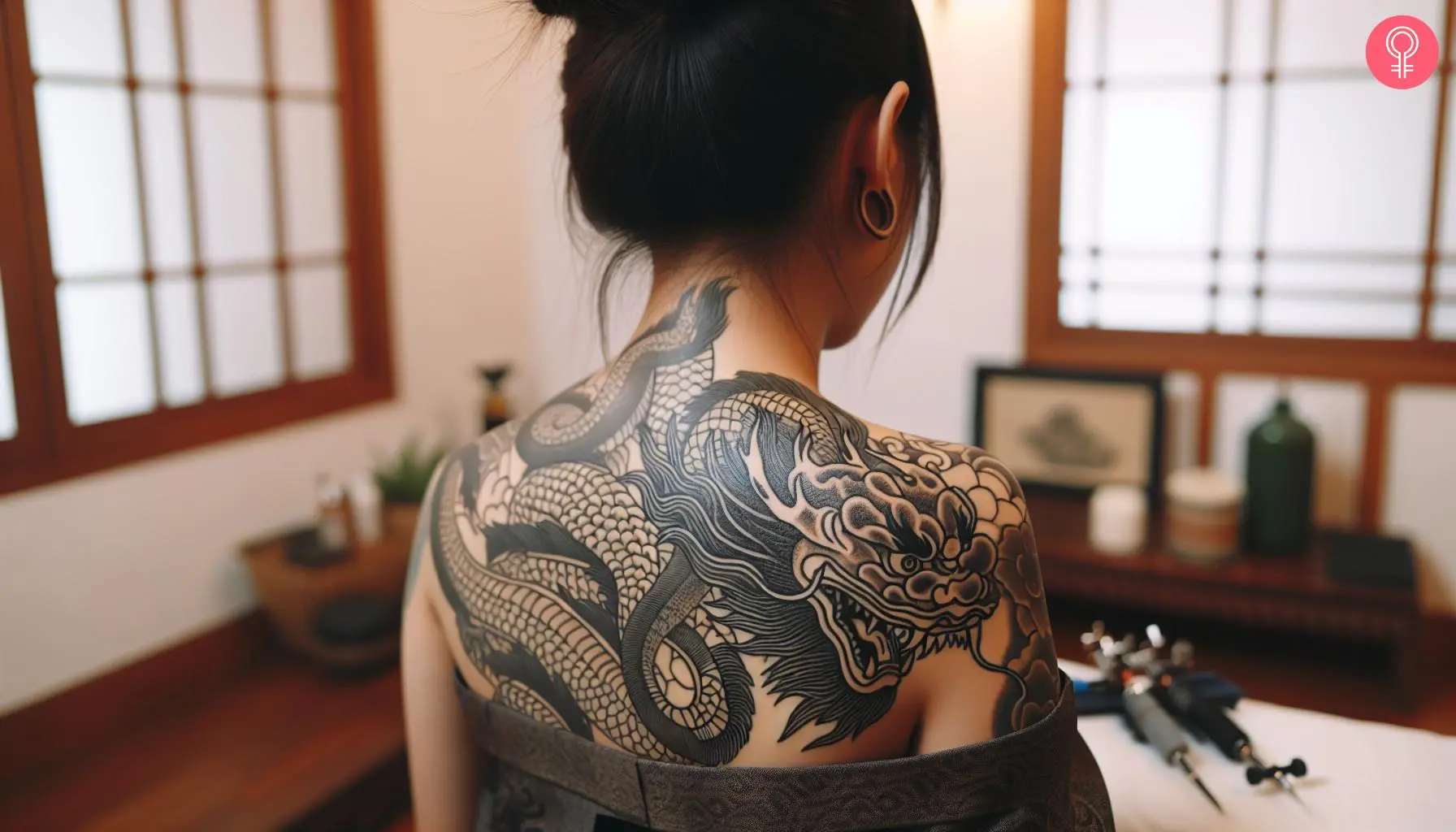 Asian dragon tattoo on the upper back of a woman