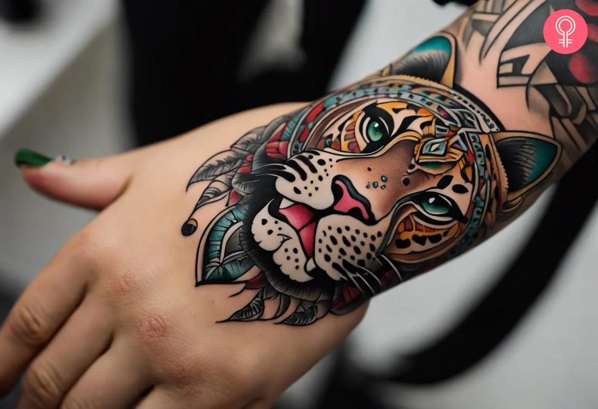 Aztec jaguar tattoo on a woman’s hand