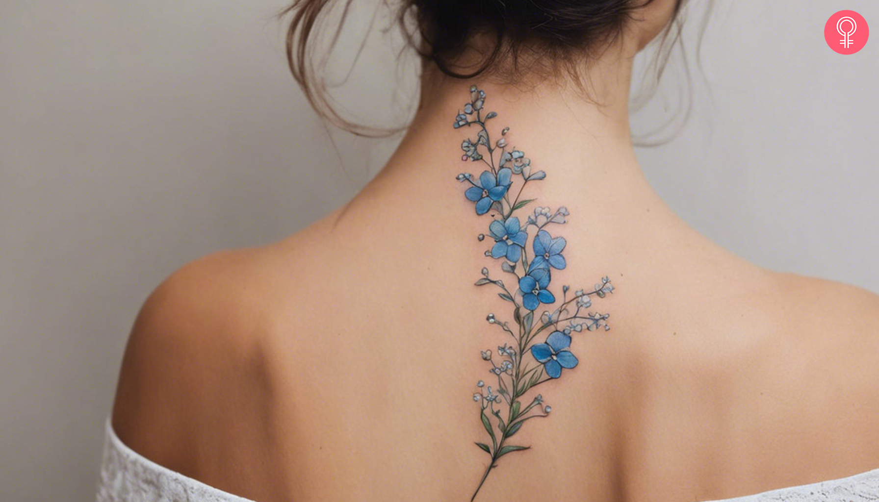 A tattoo featuring baby’s breath and forget-me-not
