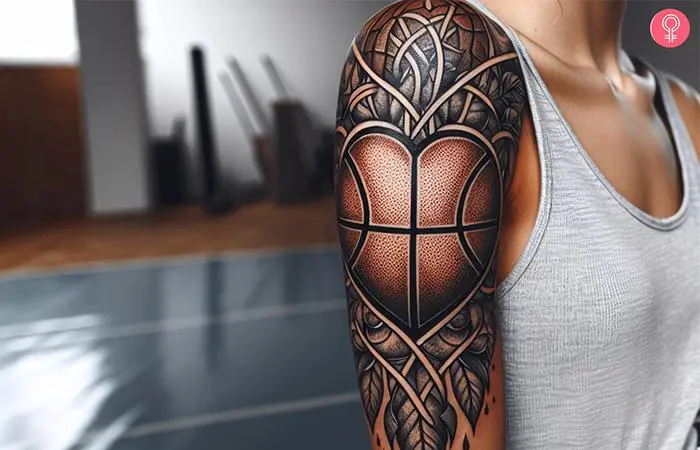 A woman with a basketball heart tattoo on her upper arm