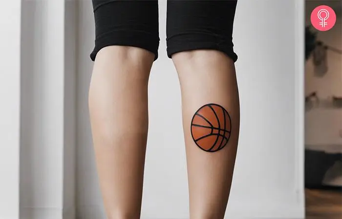 A simple basketball tattoo on a woman’s calf