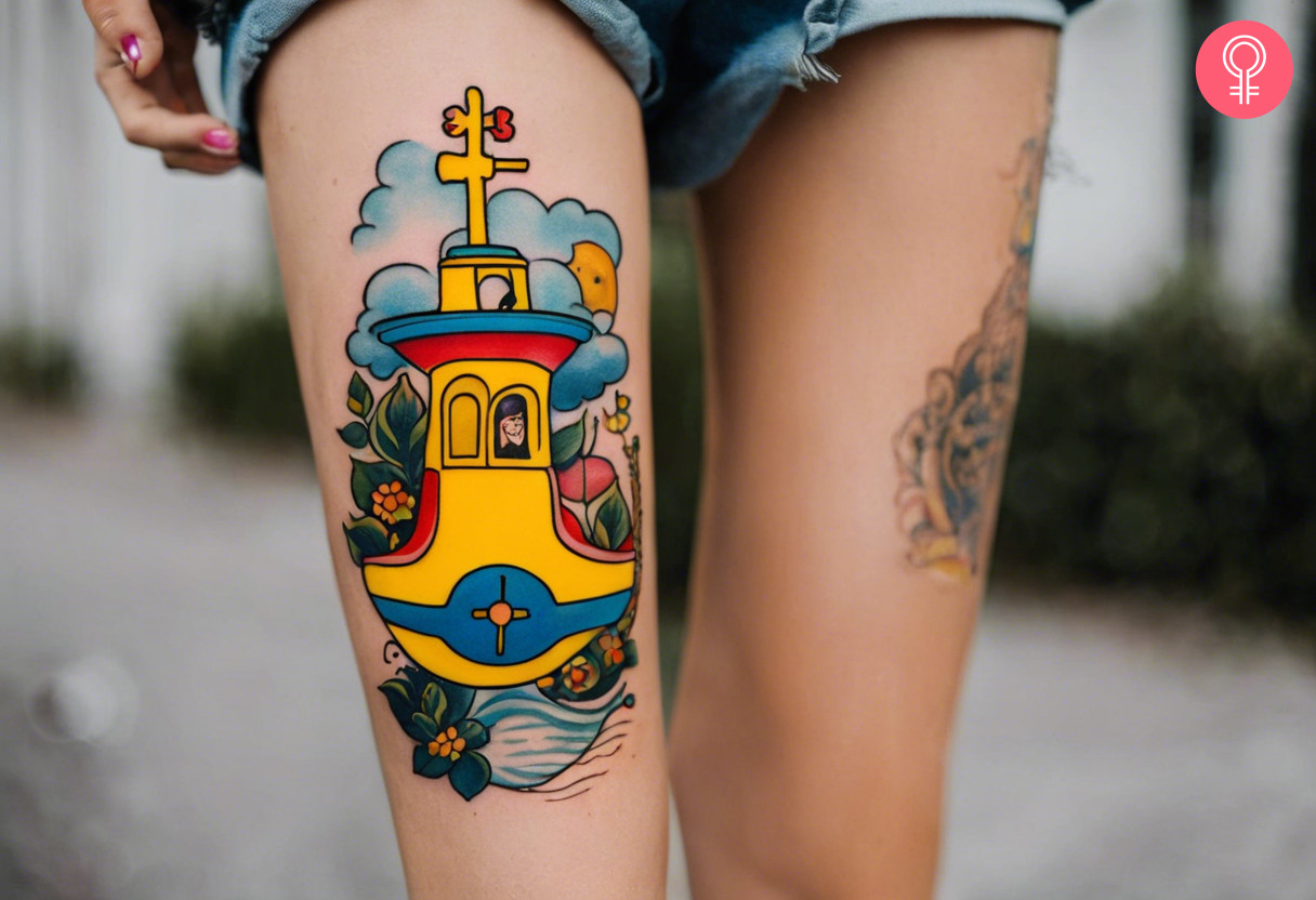 Beatles yellow submarine tattoo on a woman’s thigh