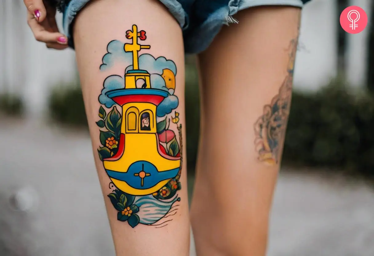 Beatles yellow submarine tattoo on a woman’s thigh