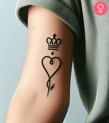 A triumph tattoo on the upper arm of a woman