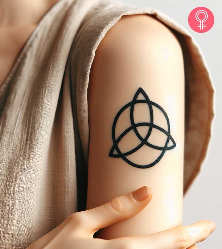Woman with Celtic knot tattoo on her arm