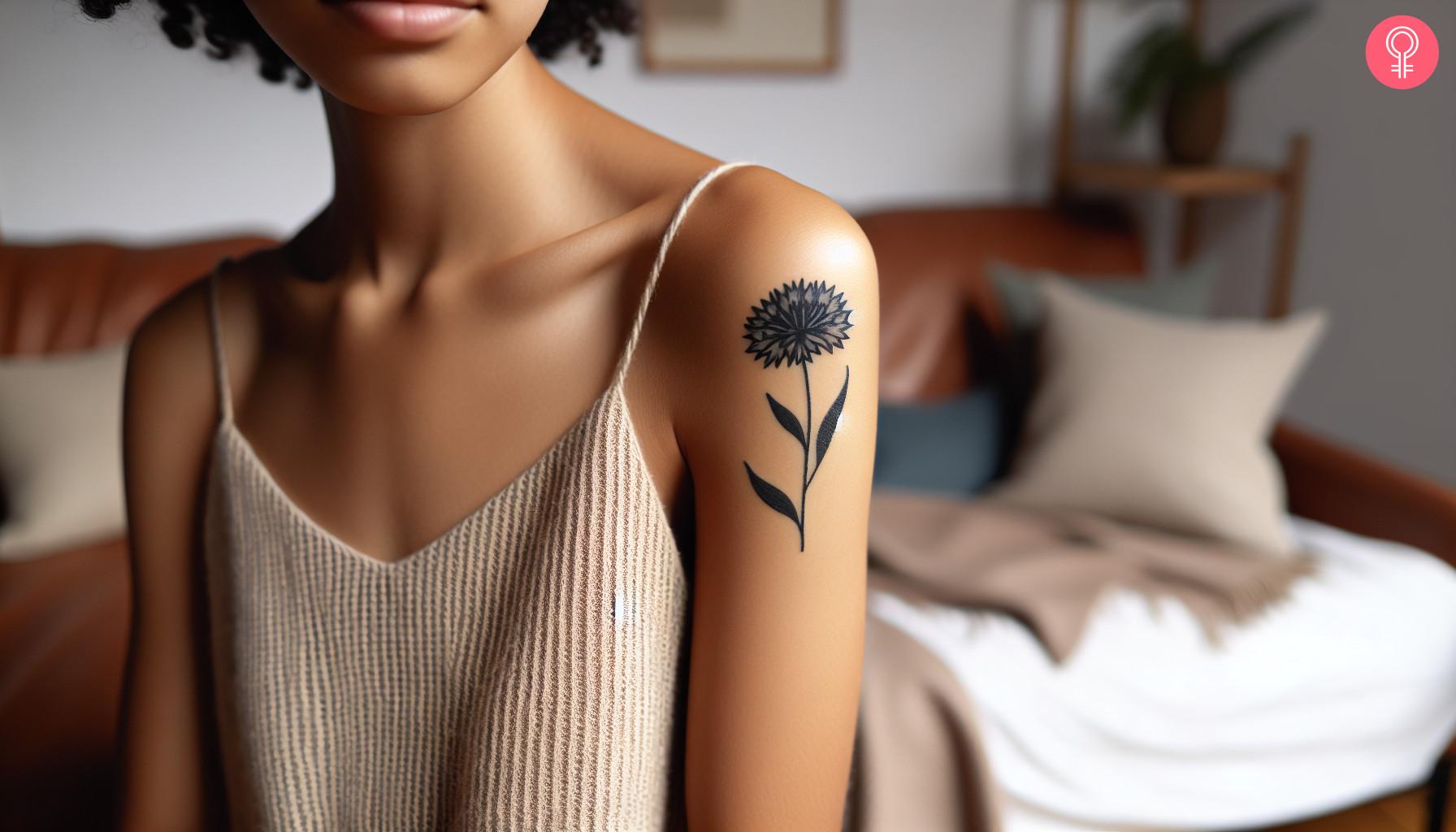 Black Cornflower Tattoo on the shoulder