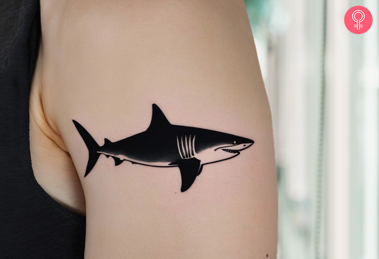 Black tiger shark tattoo on the arm