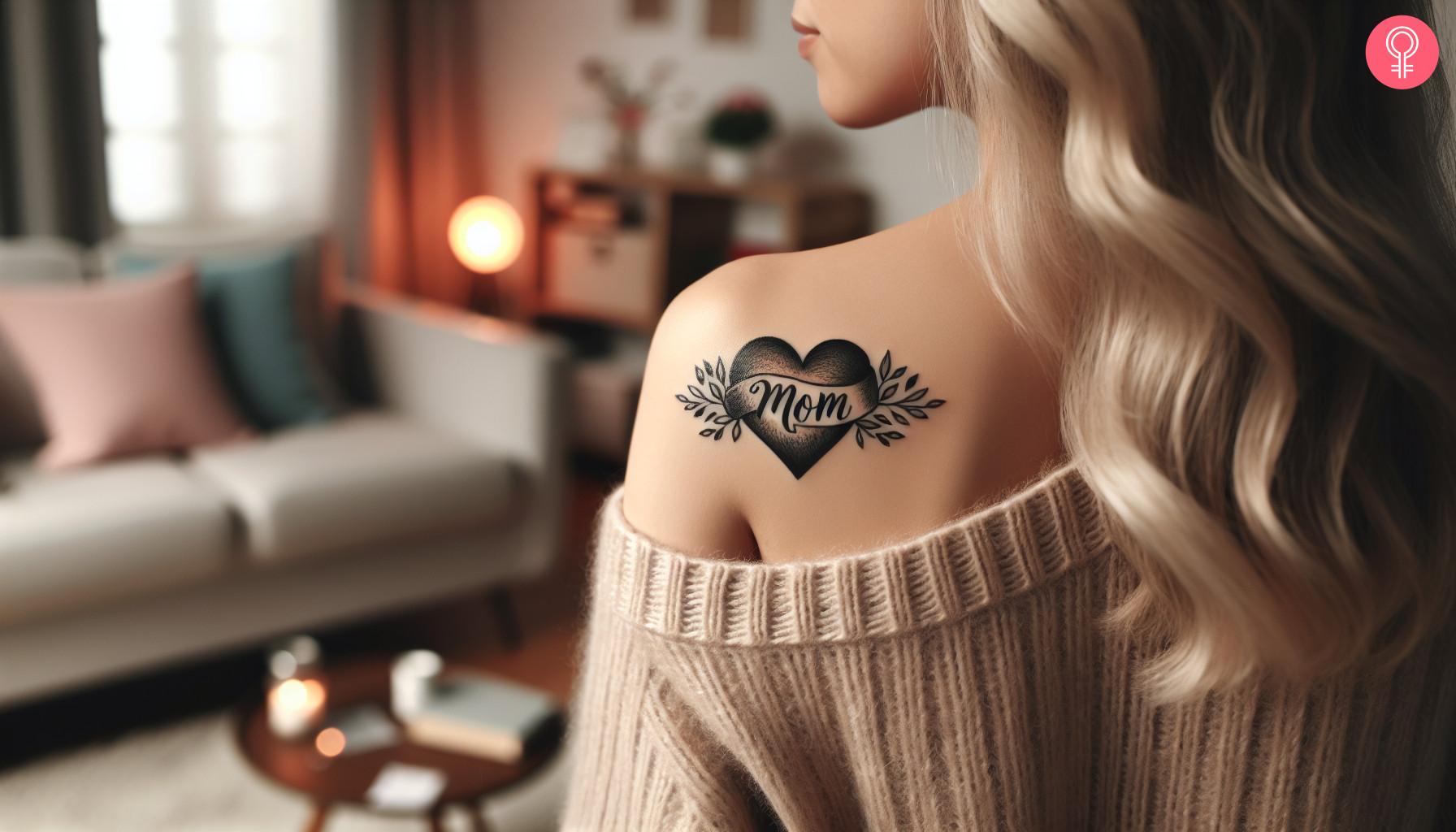 Black and gray mother heart tattoo on back of shoulder