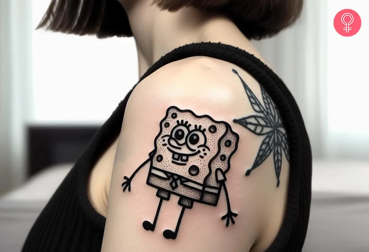 Black and white spongebob tattoo on the upper arm