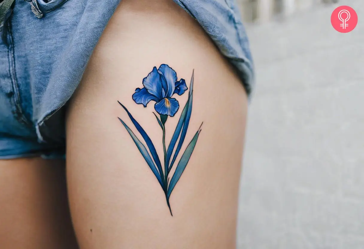 Blue iris tattoo on the thigh