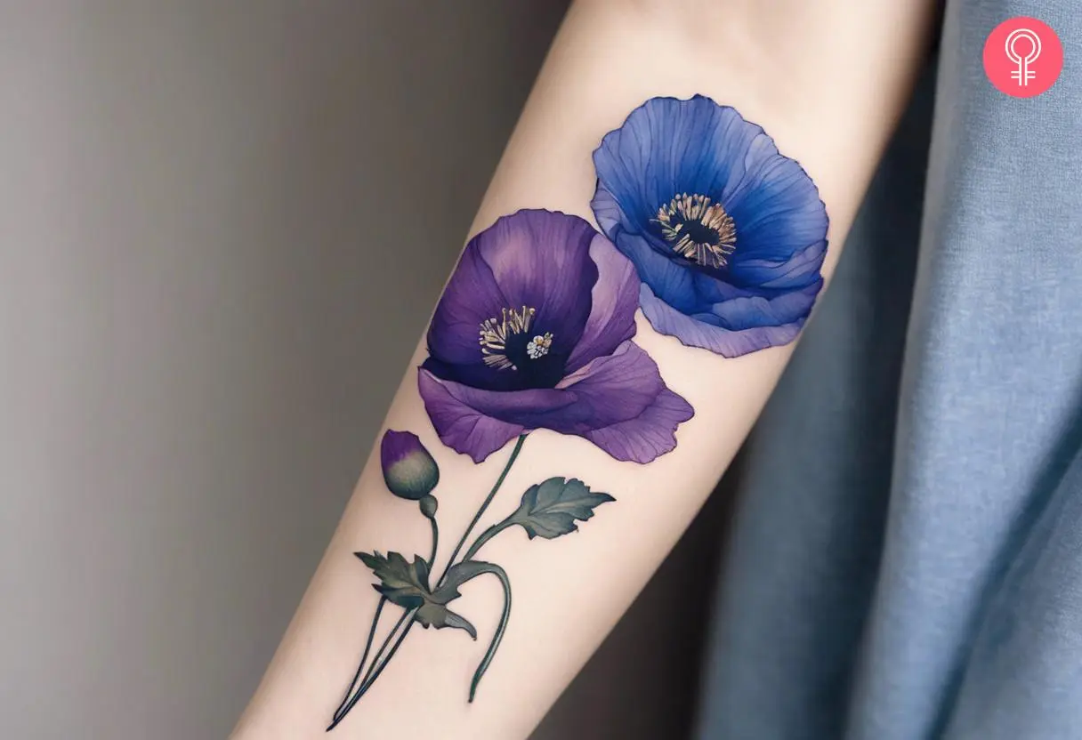 Blue and purple flower tattoo on the forearm of a woman