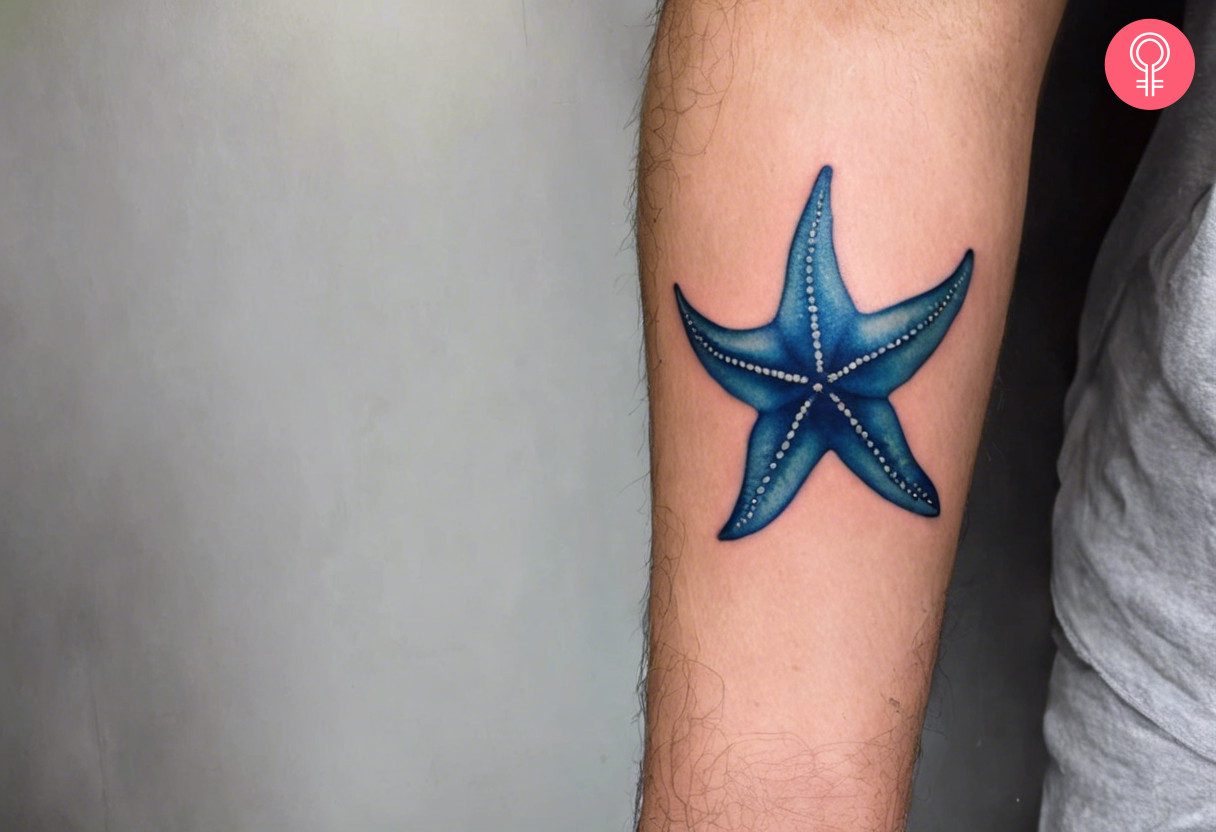 Blue starfish tattoo on the forearm