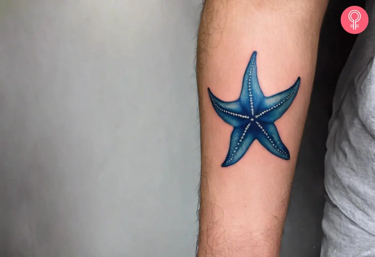 Blue starfish tattoo on the forearm