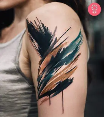 Woman with a tattoo of larkspur flowers on her shoulder