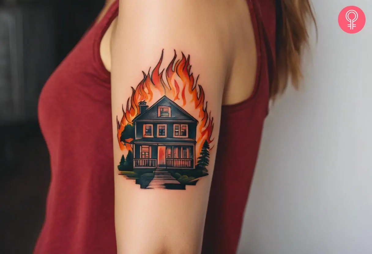 Burning house tattoo on the upper arm