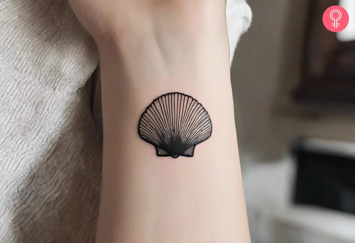 A Camino shell tattoo on a woman’s forearm