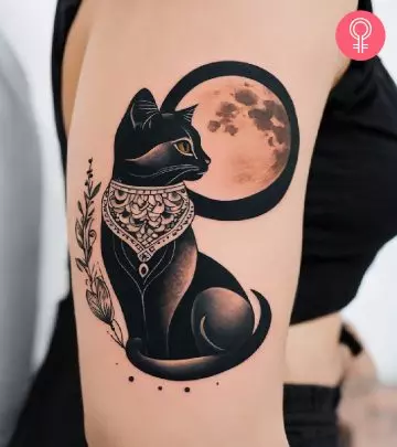 A moon and stars tattoo on the arm