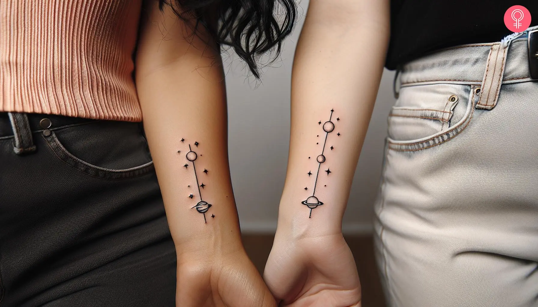 Tiny matching planet tattoos on the wrist